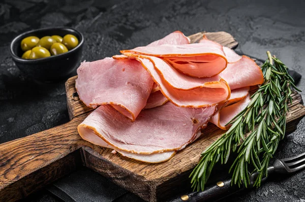 Pork ham slices on cutting board, Italian Prosciutto cotto. Black background. Top view — Stock Photo, Image