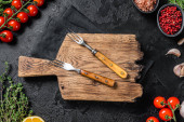 Картина, постер, плакат, фотообои "ingredients for cooking and empty cutting board on old wooden table, food cooking and healthy eating background. black background. top view. copy space", артикул 545983064