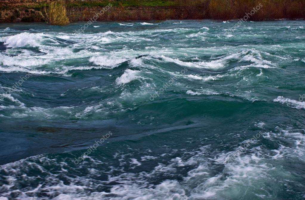 Rough river water — Stock Photo © airphotogr 24257587