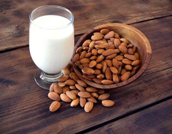 Almond milk in glass with almonds — Stock Photo, Image