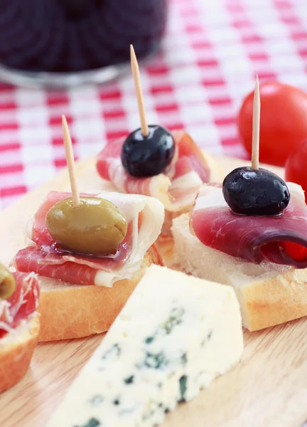 Sliced prosciutto with olive cheese and Cherry tomato Stock Picture