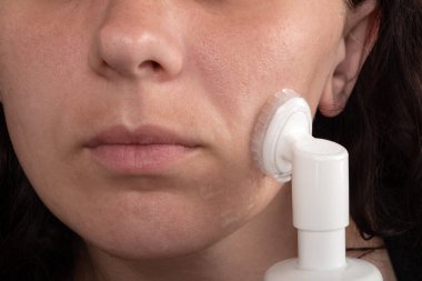 face cleaning with foam, cosmetic skin care.