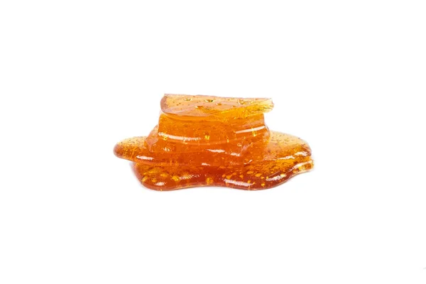 Golden Isolated Piece Cannabis Wax Shatter Dab Closeup — 스톡 사진