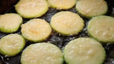 cooking zucchini slices in a pan, fried vegetables High quality FullHD footage