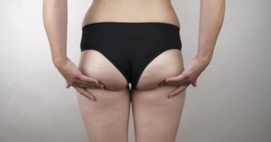 obese woman shaking buttocks in panties, obesity overweight. High quality 4k footage