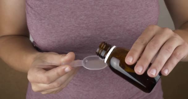 Hand Pour Bottle Medicinal Syrup Spoon High Quality Footage — Video