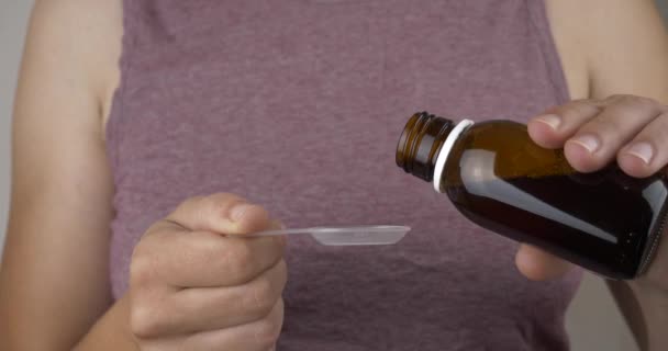 Woman Pouring Cough Syrup Spoon Treat Cold High Quality Footage — Stockvideo