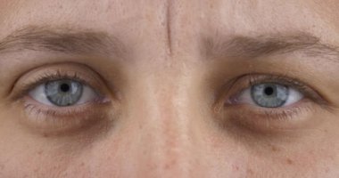 female sight, grey blue female open eyes closeup. High quality 4k footage