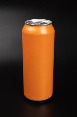 orange tin can with copy space on dark background.