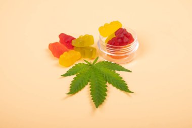 assorted cannabis thc jelly candies and green leaf, recreational drugs. clipart
