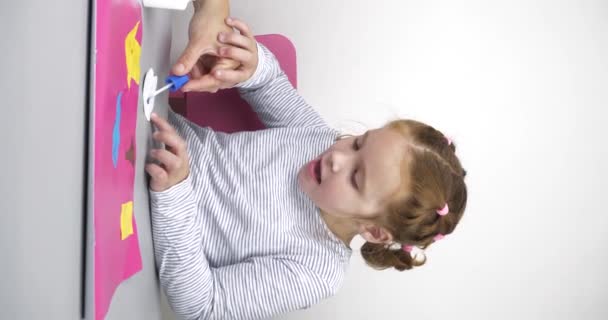 Mother Helps Her Daughter Autism Syndrome Spread Glue Colored Paper — Stock Video