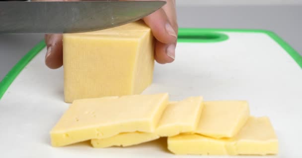 Cutting Cheese Slice Pieces Knife Closeup High Quality Footage — Stock Video