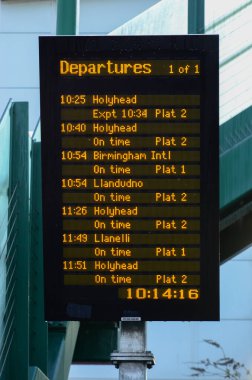 Prestatyn, UK: Dec 14, 2021: An electronic display panel lists forthcoming departures from Prestatyn train station