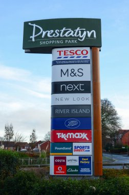Prestatyn, UK: Dec 14, 2021:A sign at the Nant Hall Road entrance lists the shops which are on Prestatyn Shopping Park.