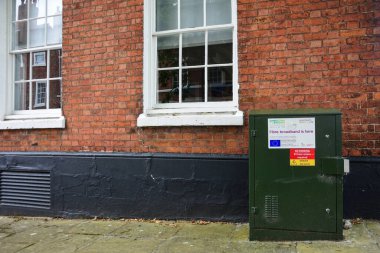 Chester, UK: Jul 3, 2022: An Openreach roadside telecoms distribution box with information about fibre broadband.
