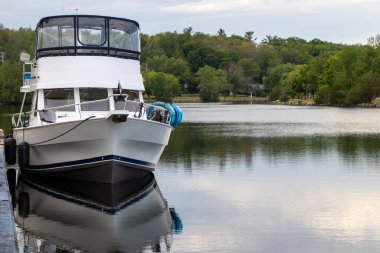 Boat tied up at the wall on the Trent-Severn in Campbellford