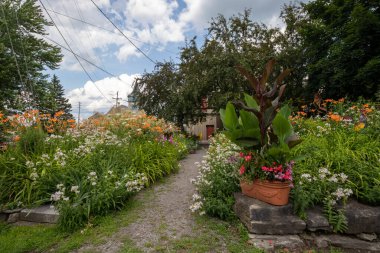 Path through a pretty flower garden in Merrickville, Ontario, Canada