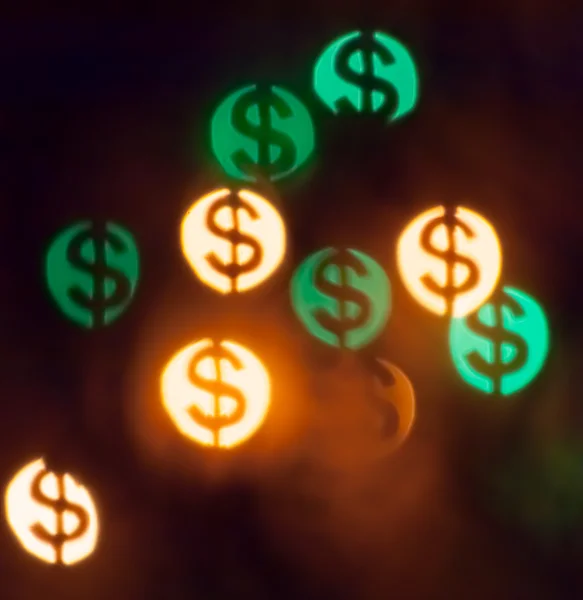 Bokeh in shape of dollars — Stock Photo, Image