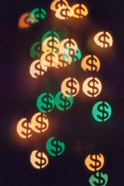 Bokeh in shape of dollars — Stock Photo, Image