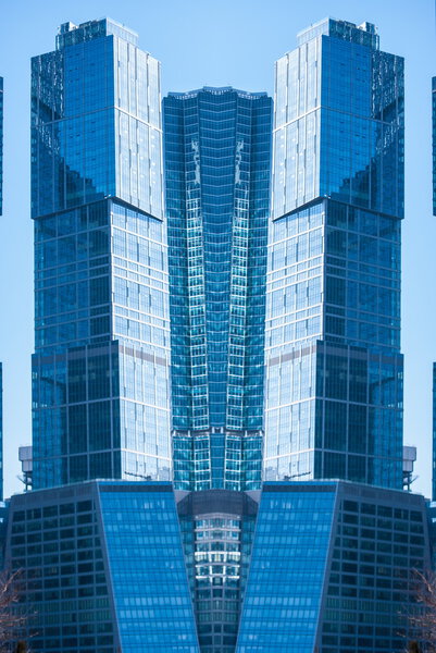 Digitally transformed photo of modern office building. Business background.