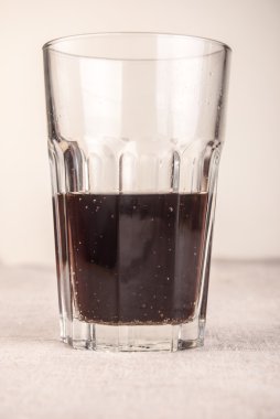 cola in glass on table