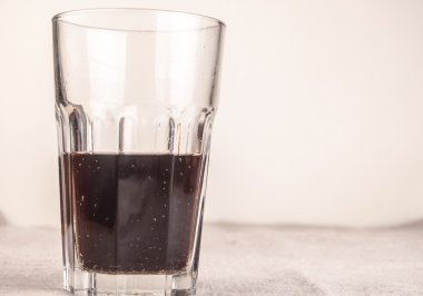 cola in glass on table