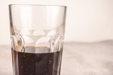 cola in glass on table
