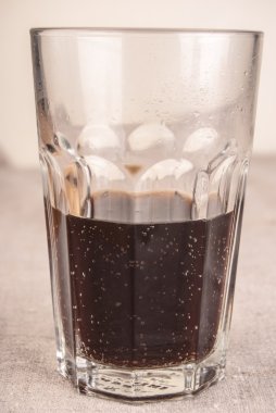 cola in glass on table