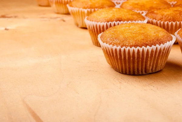 Close-up of cupcakes on wooden board. — Stock Photo, Image