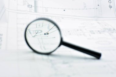 Büyüteçle, mimari projeyle ilgili planlara bakma kavramı