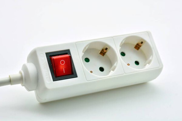 Power strip switch turned on, isolated on white background