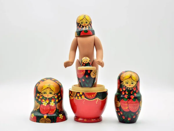 Russian dolls, matryoshkas, put in different ways, isolated over white