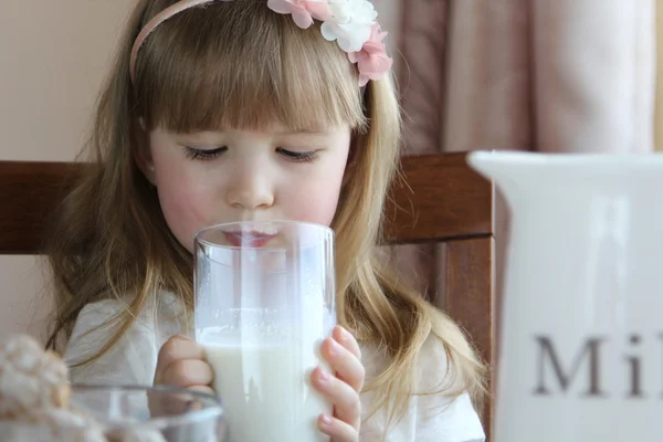 Little girl drinking a milk Stock Photo