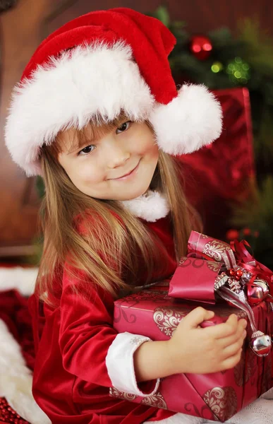Little girl holding Christmas box Royalty Free Stock Images