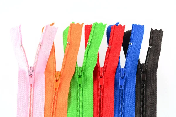 Zippers of many colors on a white background — Stock Photo, Image