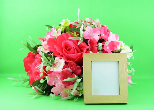 Photo frame and flowers — Stock Photo, Image