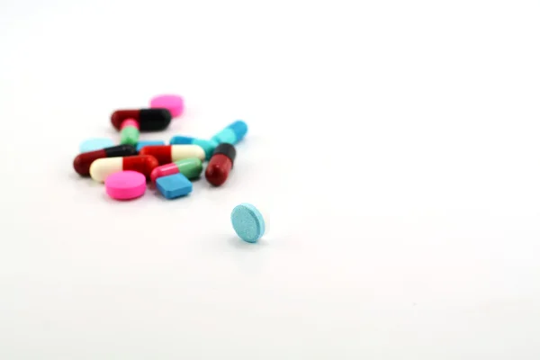 Colorful medical pills and capsules on white background. — Stock Photo, Image