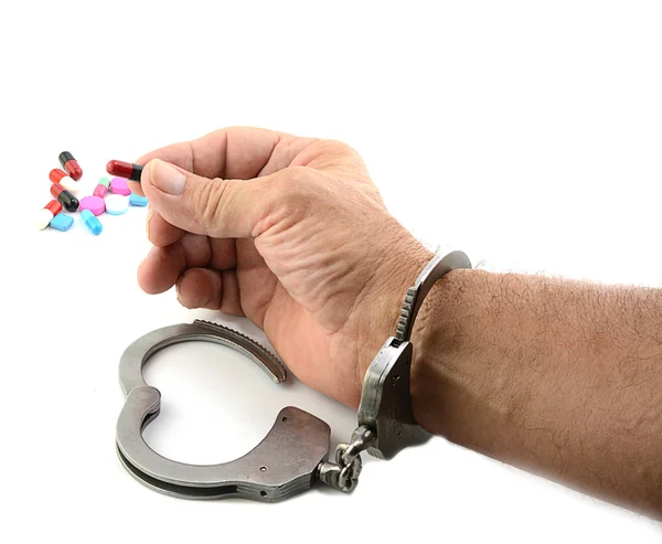 Handcuffed Man Holding Medicine — Stock Photo, Image
