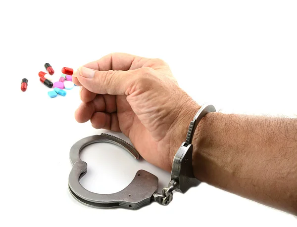 Handcuffed Man Holding Medicine — Stock Photo, Image