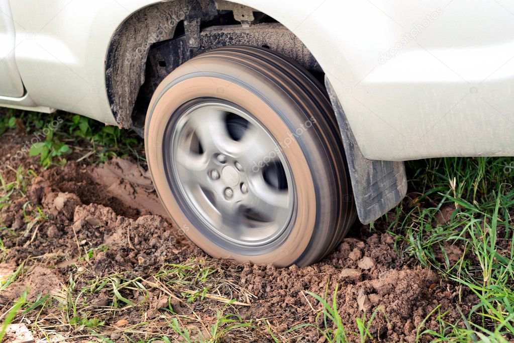 Car's wheels in mud