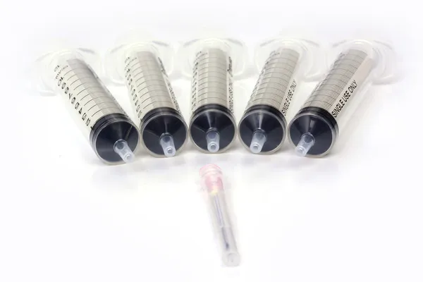 Medical syringes on a white — Stock Photo, Image