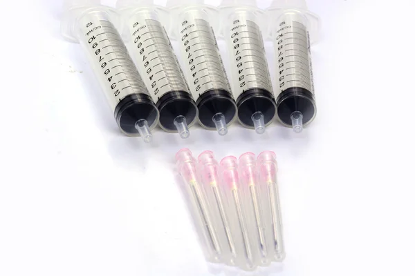 Medical syringes on a white — Stock Photo, Image
