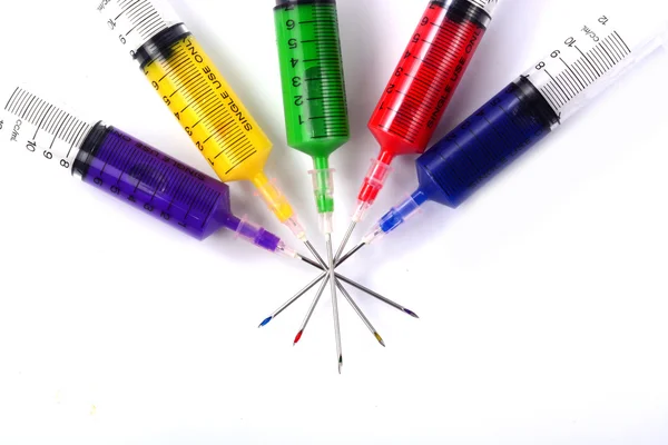 Syringe filled with colors. — Stock Photo, Image