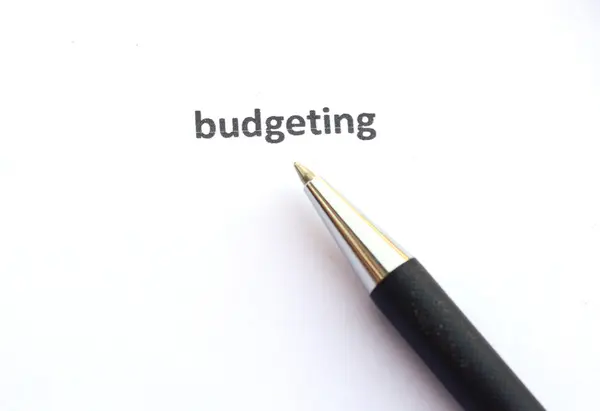 Budgeting with pen — Stock Photo, Image