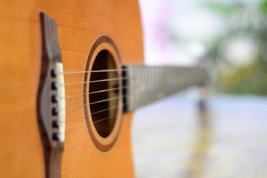 detail of acoustic guitar with shallow depth of field clipart