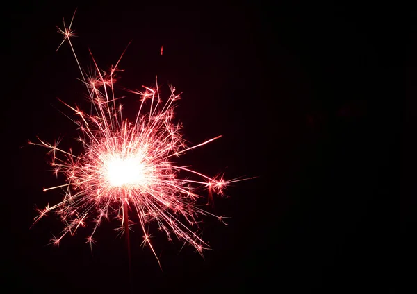 Christmas and newyear party colourful sparkler on black — Stock Photo, Image