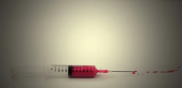 Syringe with blood — Stock Photo, Image