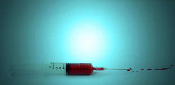 Syringe with blood — Stock Photo, Image