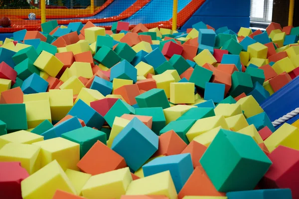 Colored Soft Cubes Fill Dry Pool Children Jumping — Stock Photo, Image