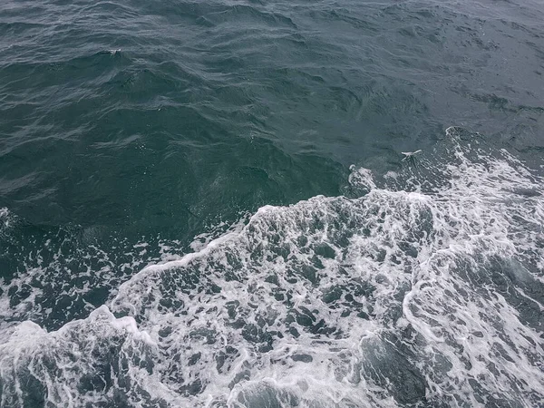 Surface of blue water Sea wave Colored background